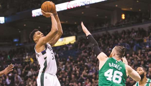 Milwaukee Bucks forward Giannis Antetokounmpo shoots against Boston Celtics centre Aron Baynes during the fourth quarter of their first round NBA playoff game. PICTURE: USA TODAY Sports