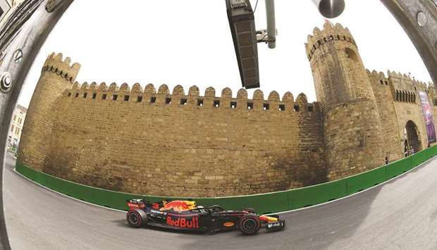 Red Bullu2019s Australian driver Daniel Ricciardo steers his car during the first practice session ahead of the Formula One Azerbaijan Grand Prix in Baku yesterday. (AFP)