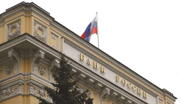 A Russian national flag flies over the central bank headquarters in Moscow. The Bank of Russia said on Friday that u201cthe estimated neutral interest rate has shifted closer to its upper bound within the range.u201d
