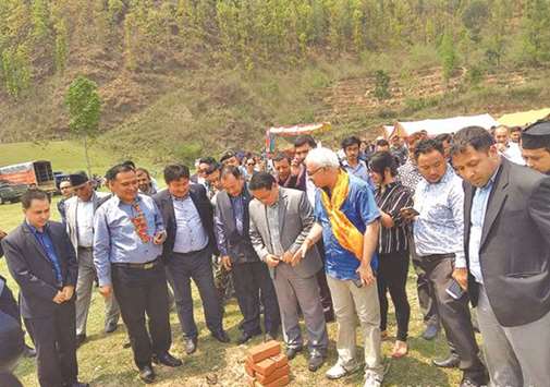 Nepalu2019s Energy Minister Barsha Man Pun (second right) lays the foundation stone for the 25MW solar project in Nuwakot.