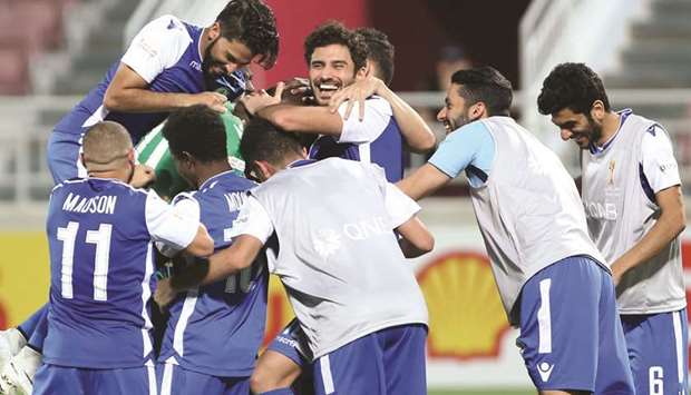Al Khor players celebrate their victory over Al Markhiya after the penalty shootout in the quarter-finals of the Emir Cup at Abdulla bin Khalifa Stadium yesterday. PICTURE: Jayan Orma