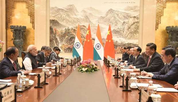 Chinese President Xi Jinping and Indian Prime Minister Narendra Modi attend a meeting at East Lake Guest House, in Wuhan