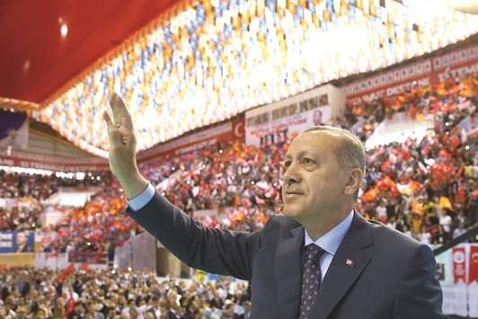 Erdogan acknowledges applause after delivering a speech during the AK Partyu2019s 6th ordinary provincial congress in western Izmir province.