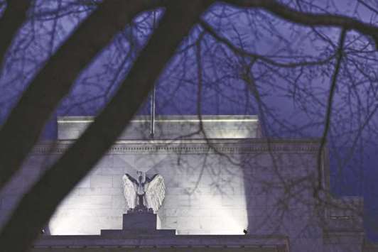 The Federal Reserve building in Washington, DC. While the central bank will leave the benchmark lending rate untouched on Wednesday, investors will be reading anxiously between the lines for signs of how concerned the officials appear to be about rising wages and inflation.