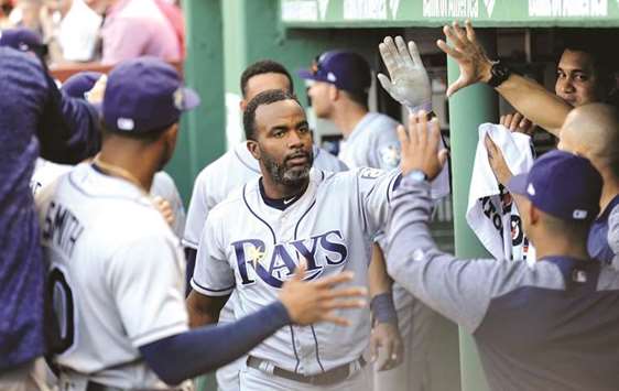 Tampa Bay Rays left fielder Denard Span is congratulated in the dugout after hitting a single and scoring on a fielders error during the second inning against the Boston Red Sox at Fenway Park. PICTURE: USA TODAY Sports