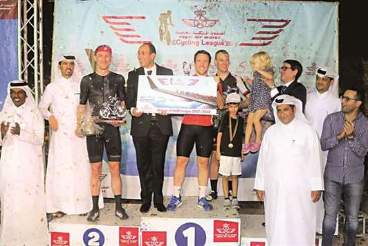 Qatar Cycling and Triathlon Federation president Dr Mohamed Jeham al-Kuwari and Royal Air Maroc (RAM) regional director Adel Khalloufi with the winners of the RAM Cycling League at Al Bidda Park.
