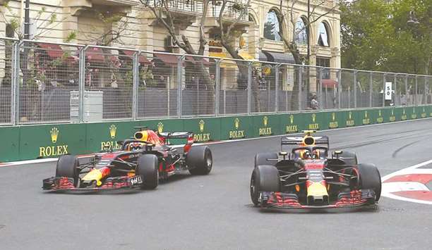Red Bullu2019s Daniel Ricciardo and Max Verstappen in action during the Azerbaijan Grand Prix at Baku City Circuit yesterday. (Reuters)