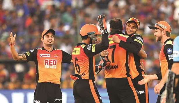 Sunrisers Hyderabadu2019s Yusuf Pathan (centre) celebrates the wicket of Rajasthan Royalsu2019 Ben Stokes with captain Kane Williamson (right) and teammates during the 2018 Indian Premier League Twenty20 match at the Sawai Mansingh Stadium in Jaipur yesterday. (AFP)