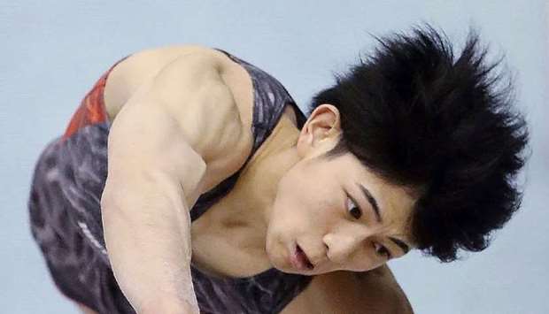 Japanese Kakeru Tanigawa competes in the men's vault during Japan's National Gymnastics Championships in Tokyo