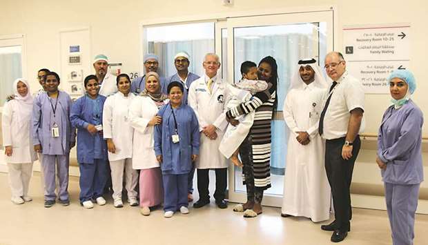 Two-year-old Amanuel Endale and his mother are seen with ACC director Dr Khalid al-Jalham and the anaesthesia and ENT team.