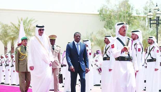 President of Togo Faure Essozimna Gnassingbe, accompanied by His Highness the Amir Sheikh Tamim bin Hamad al-Thani inspects a guard of honour   during the official reception at the Amiri Diwan.