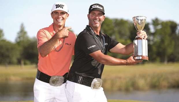 Billy Horschel and Scott Piercy pose with the trophy and commemorative belts during the final round of the Zurich Classic at TPC Louisiana in Avondale, Louisiana. (Getty Images/AFP)