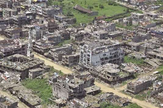A recent photo shows an aerial shot of bombed-out houses in Marawi City, in southern island of Mindanao, after five months of house-to-house fighting between troops and militants loyal to the Islamic State group that killed nearly 1,200.