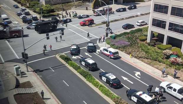 Officials are seen following a possible shooting at the headquarters of YouTube, in San Bruno