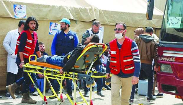 A QRCS medical team providing assistance to Syrian IDPs.rnrn