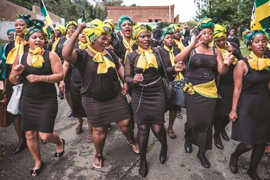Members of the ANC Womenu2019s League pay tribute to late South African anti-apartheid campaigner Winnie Madikizela-Mandela outside her Orlando Soweto house on the outskirts of Johannesburg.