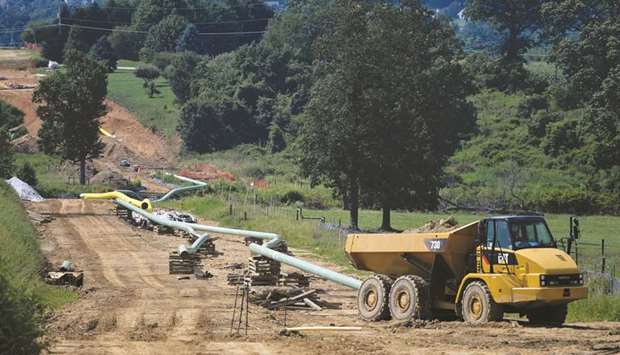 Sections of pipe and a Caterpillar truck are seen at an Energy Transfer Partners construction site for a gas liquids pipeline project near Morgantown, Pennsylvania. Energy Transfer Partners, Boardwalk Pipeline Partners, and Chesapeake Utilities Corpu2019s Eastern Shore Natural Gas reported breakdowns in their electronic systems, with Eastern Shore saying its closure occurred on March 29.