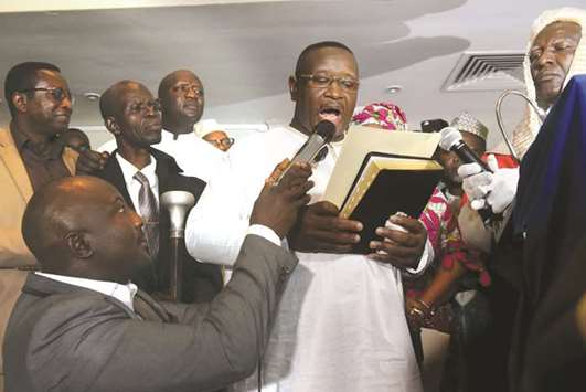 Bio takes his oath as Sierra Leoneu2019s new president in Freetown.