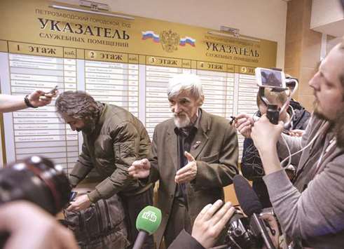 Dmitriyev speaks to the media as he leaves a court building in the city of Petrozavodsk, northwestern Russia.