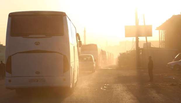 Buses carrying Jaish al-Islam fighters and their families, from the former rebel bastion's main town of Douma, arrive in the Syrian town of Azaz