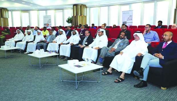 Qatar University and Ashghal officials at the workshop