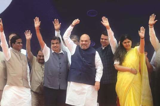 BJP chief Amit Shah, Union Minister of Road Transport and Highways Nitin Gadkari, Maharashtra Chief Minister Devendra Fadnavis, Women and Child Welfare Minister Pankaja Munde and state president Raosaheb Danve-Patil attend the rally organised to celebrate BJPu2019s 38th Foundation Day in Mumbai yesterday.