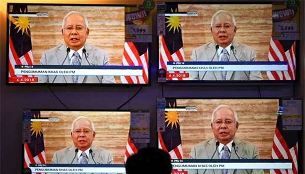 Malaysian Prime Minister Najib Razak announces the dissolution of Parliament as he addresses the nation during a live telecast in Kuala Lumpur on Friday.
