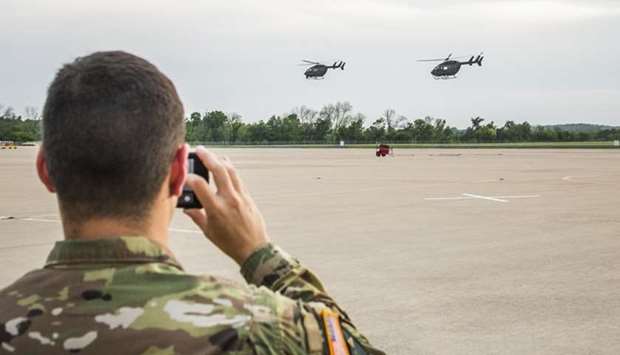 Texas National Guard helicopters traveling to the Texas-Mexico border fly off  in Austin