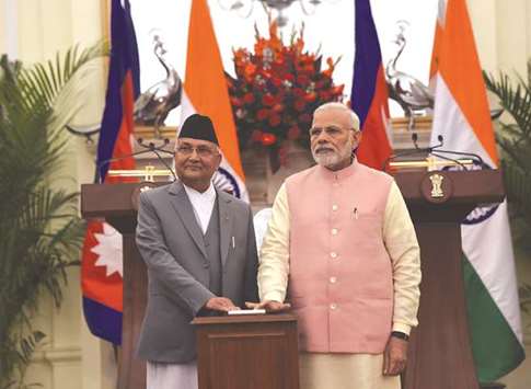 Indian Prime Minister Narendra Modi, right, and his Nepali counterpart  K P Sharma Oli look on during the inauguration of India-Nepal petroleum products pipeline and the Integrated Check Post (ICP), at Hyderabad House, in New Delhi yesterday.