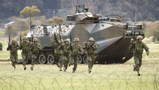 Soldiers of Japanese Ground Self-Defence Forceu2019s (JGSDF) Amphibious Rapid Deployment Brigade, the nationu2019s first marine unit since World War Two, take part in a drill at JGSDFu2019s Camp Ainoura in Sasebo, on the southwest island of Kyushu, yesterday.