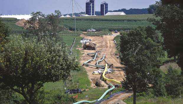 Sections of pipe are seen near a farm at an Energy Transfer Partners construction site near Morgantown, Pennsylvania. In website notices to customers this week, at least seven pipeline operators from Energy Transfer Partners to TransCanada Corp said their third-party electronic communications systems were shut down, with five confirming the service disruptions were caused by hacking.