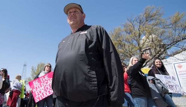 Scott Teel walks the picket line during a teachersu2019 rally at the state capitol in Oklahoma City