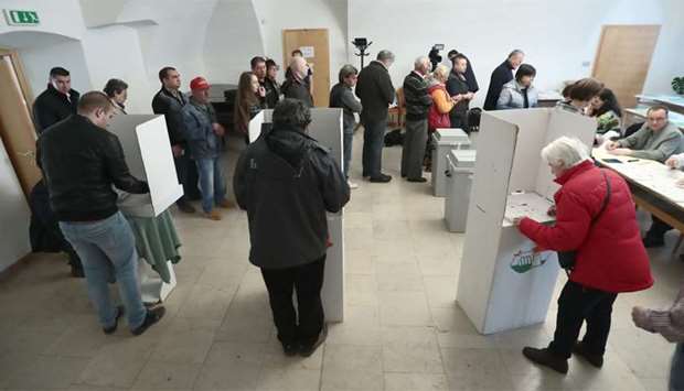 Hungarian voters cast their ballots in Gyoengyoes, 75 kms far from Budapest during the general elect