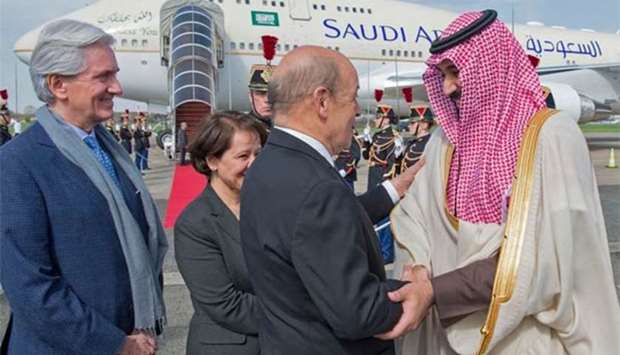 French Foreign Affairs Minister Jean-Yves Le Drian welcomes Saudi Arabia's Crown Prince Mohammed bin Salman at Le Bourget airport, north of Paris, on Sunday.