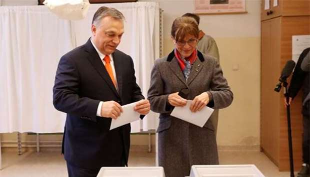 Hungarian Prime Minister Viktor Orban and his wife Aniko Levai vote during parliamentary elections in Budapest on Sunday.