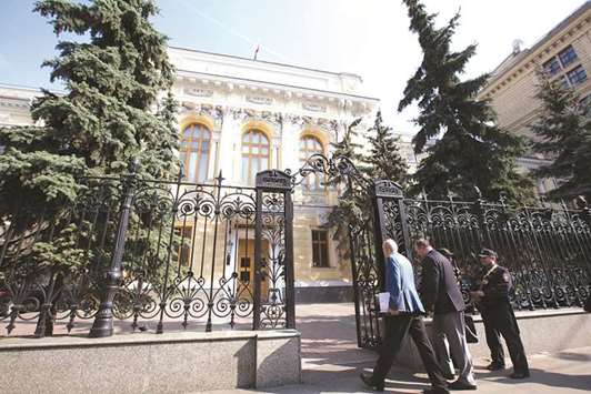 Visitors pass security to enter the headquarters of Russiau2019s central bank in Moscow (file). The Bank of Russia assumes that inflation, which has been at 2.2% during the first two months of the year, will reach 3% to 4% in late 2018 and remain near its goal of 4% in 2019.