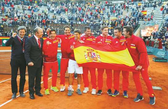 Spain players celebrate winning their Davis Cup quarter-final against Germany in Valencia yesterday. (Reuters)