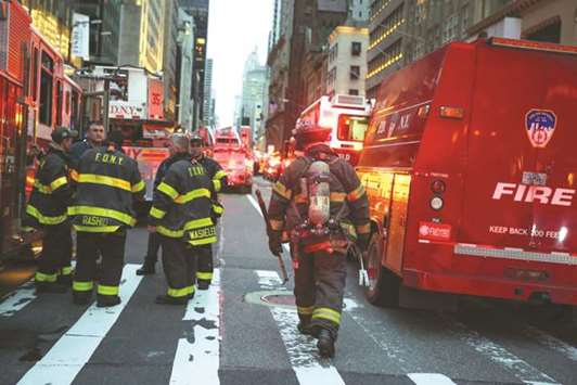 First responders work on a fire in a residential unit of Trump Tower in the Manhattan borough of New York City late on Saturday.