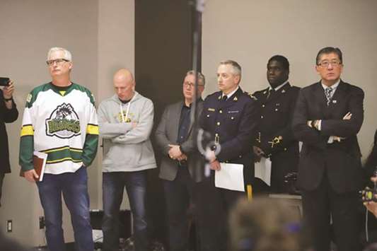 Rob Muench (left), Mayor of the City of Humboldt, and others attend a press conference at the Humboldt Uniplex in Humboldt, Saskatchewan late on Saturday.