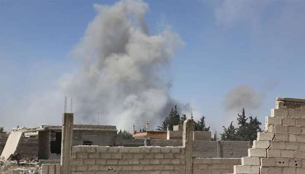 Smoke billows in the town of Douma, the last opposition holdout in Syria's Eastern Ghouta