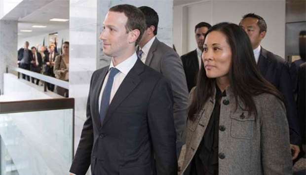 Mark Zuckerberg and Priscilla Chan depart US Senator Bill Nelson's office on Capitol Hill in Washington, DC, on Monday.