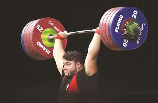Nooh Dastgir Butt of Pakistan lifts on the way to his bronze medal in the menu2019s +105kg weightlifting at the Commonwealth Games.