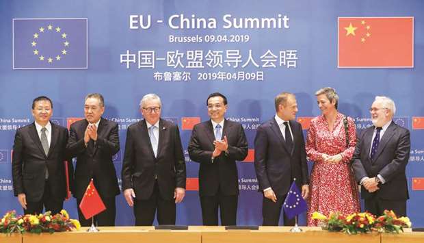 Chinese Premier Li Keqiang, European Council president Donald Tusk and European Commission president Jean-Claude Juncker with other dignitaries at the EU-China Summit in Brussels yesterday. The annual meeting brings together Chinau2019s number two leader and the EUu2019s top officials and serves as a litmus test of the state of ties between Europe and the Asian giant.