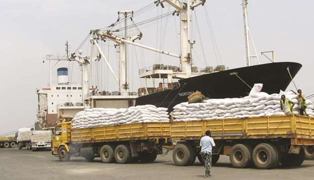 Longshoremen unload US food aid, bound for Ethiopia, at the Port of Djibouti in Djibouti in this photo dated August 26, 2008. Djibouti, which has built up a small, but vital Islamic finance sector over the past two decades, is part of the growing number of East African countries to push Islamic finance as a core strategy for their banking sector.