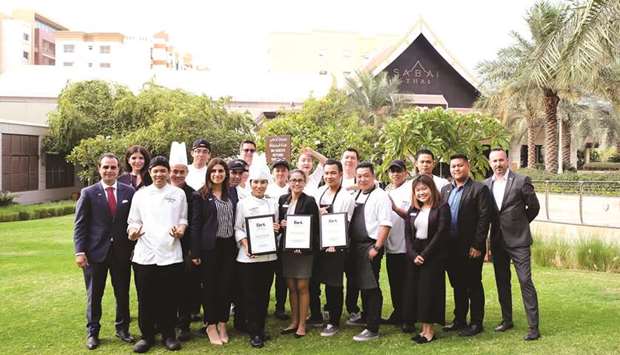The Westin officials and staff with the awards.
