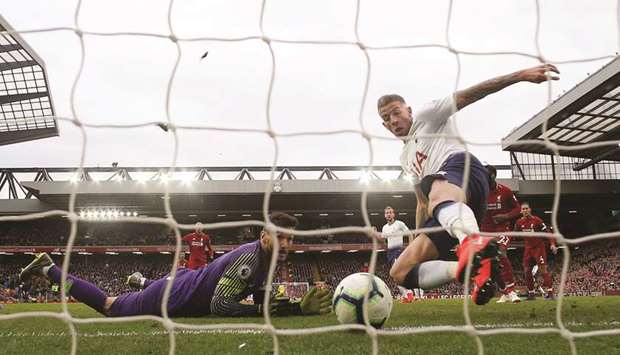 Tottenhamu2019s Toby Alderweireld (right) scores an own goal during the Premier League match against Liverpool in Liverpool, England, yesterday. (Reuters)