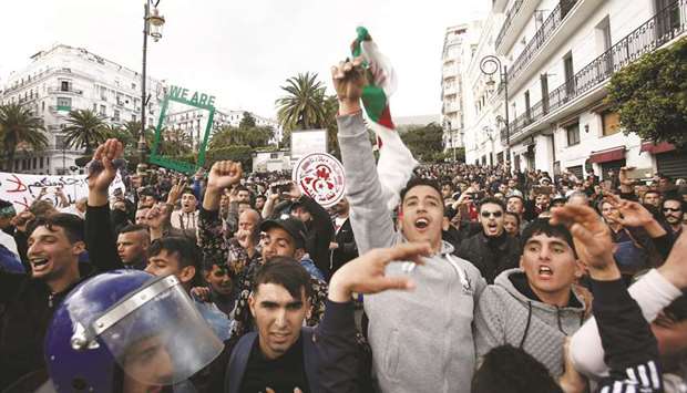 People protest against the appointment of interim president Abdelkader Bensalah and demanding radical changes to the political system in Algiers, yesterday.