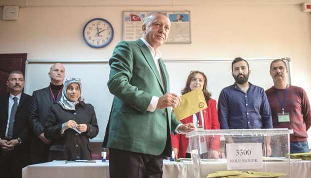 Turkish President Recep Tayyip Erdogan casts his ballot at a polling station in Istanbul yesterday.