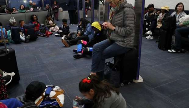 Passengers wait to board a delayed Southwest flight at Ronald Reagan Washington National airport in Arlington, VA, US.