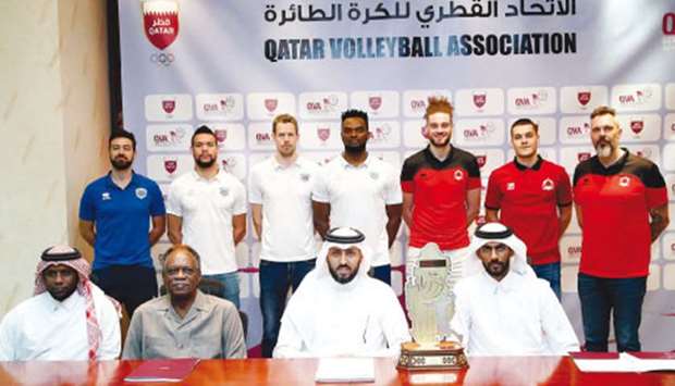 Al Rayyan and Police players, coaches and QVA officials pose with the Qatar Volleyball Cup trophy. PICTURE: Jayaram